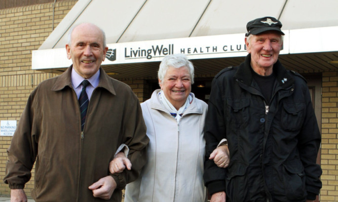 Jim and Agnes Martin and George Ness leaving the Hiltons Living Well health club for the last time.