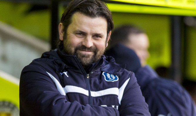 Dundee manager Paul Hartley is all smiles at the final whistle.