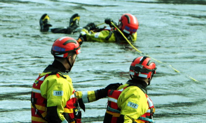 Fire service personnel stage a mock river rescue at the North Inch.