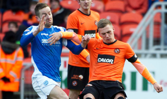 Barry Douglas (right) clears the ball under pressure from St Johnstone's Steven MacLean earlier this season.