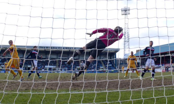 Nicky Law (left) heads the ball home to give Motherwell a two-goal lead.