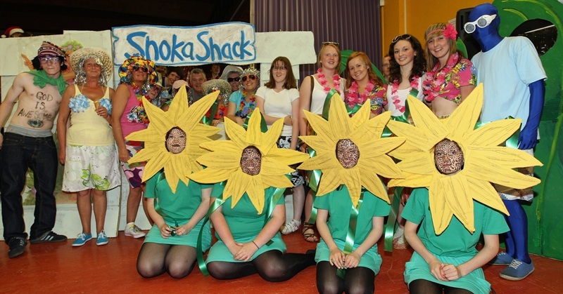 Kim Cessford, Courier - 01.07.10 - Menzieshill High School pupil Shannon Chmylowskyj wins Tayside Contracts competition to have a Radio Tay disco at the school for the day - pictured is Shannon (standing centre) with the Radio Tay disco, Tayside Contracts staff and some of the pupils who adopted a summery theme for the day