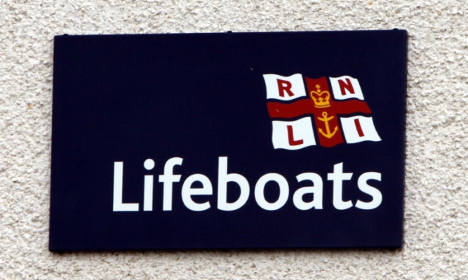 Lifeboat crews were able to rescued the man and his pet from the east dock.