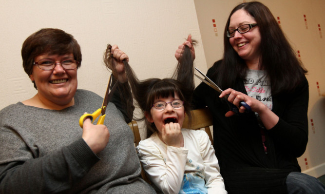 Six-year-old Iona Stewart with mum Audrey, left, and family friend Josie Robertson.