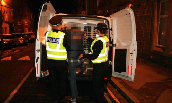 Police make an arrest after dawn raids on people in Dundee and Aberdeen.