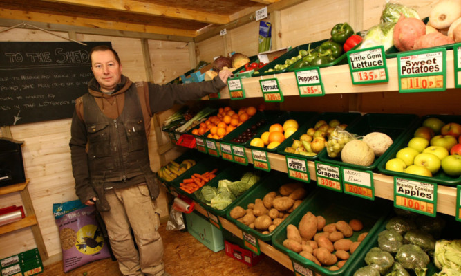 Clem with some of the vegetables he will be selling through his honesty shed.