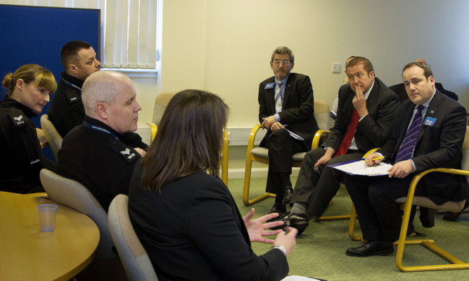 Government minister Paul Wheelhouse (right) on his visit to Forfar Police Station.