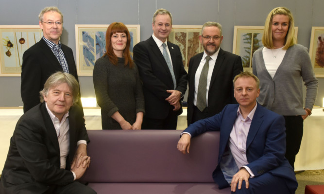 Dundee University held a public event to mark the citys status as a Unesco City of Design. The panel was (back from left) Brian Beattie,
Gillian Easson, David Martin, Stewart Murdoch and Laura Aalto. Front: Deyan Sudjic and Philip Long.