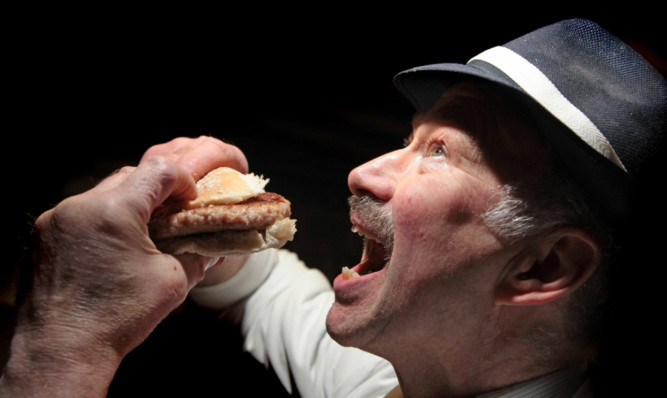 Alan Pirie of James Pirie & Son in Newtyle with one of his popular burgers.