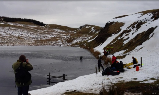 Divers continue to search for the body of the man who fell through the ice.