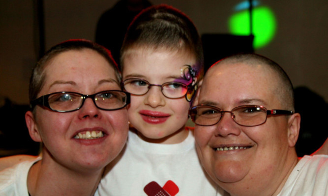 From left: Audreys friend Josie Robertson, who also got the chop, Iona and Audrey after their hair was shaved off.