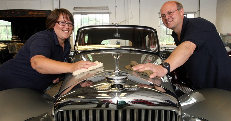 Steve MacDougall, Courier, Milford Garage, Kirkmichael. Summer Festival. The classic cars of Milford Garage were on display as part of the festival events. Pictured, garage owners Ian and Sarah Milford putting a shiny finish on a Mark VI Bentley.