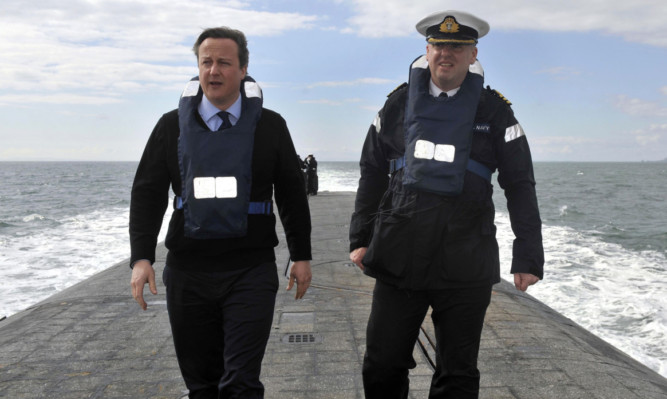 David Cameron with Commander John Livesey on HMS Victorious on patrol off the west coast of Scotland.