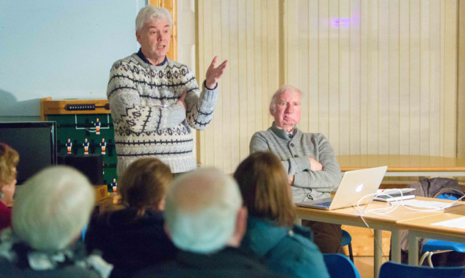 Bryan Poole and Willie Clarke speak to residents in Cupar.