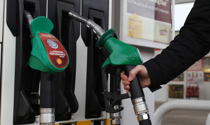 Embargoed to 0001 Friday April 5
File photo dated 18/3/2013 of motorist filling up with petrol at a forecourt. Petrol sales have plummeted in the last five years, according to official figures. PRESS ASSOCIATION Photo. Issue date: Thursday April 4, 2013. In 2007, forecourts sold 22.87 billion litres of petrol but the annual figure had slid to 17.42 billion litres by 2012, Government statistics highlighted by the AA showed. See PA story TRANSPORT Fuel. Photo credit should read: Lynne Cameron/PA Wire