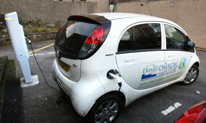 A Dundee City Council electric car at a charging point in Mitchell Street.