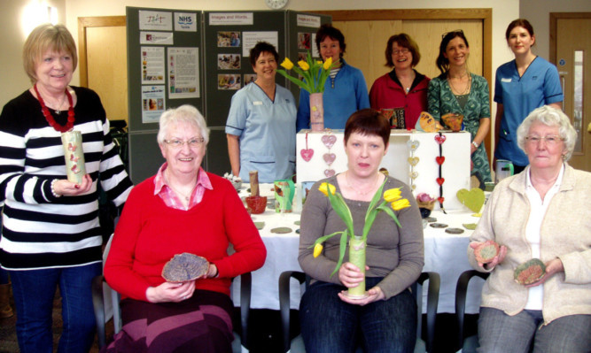 (Back) Rehab assistant Sarah McCreadie, Annette McBride, Fran Marquis, Karine Neill and staff nurse Louise Rattray.(Front) participants Margaret Japp, Mary McLaren, Lynn McKenzie and Irene Bettaney with their artworks.