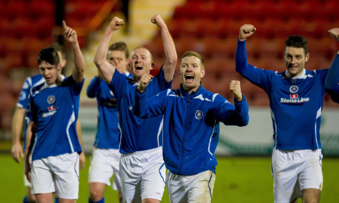 Stranraer players celebrating at full time having beaten Dunfermline to progress to the next round of the cup
