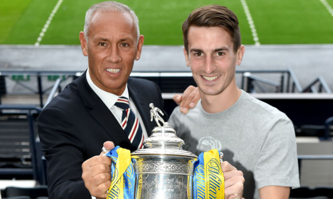 Grant Anderson pictured with former Rangers star Mark Hateley and the Scottish Cup.