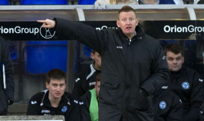 St Johnstone manager Steve Lomas urges his side on from the dugout.
