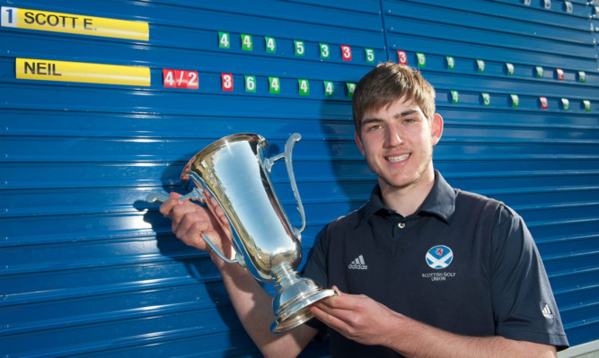 Winner Bradley Neil proudly shows off the trophy after defeating Ewan Scott.