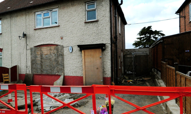 Tributes outside Mick Philpott's house in Victory Road, Derby.Mick and his Mairead Philpott, were  sentenced  to life and 17 years respectively of the unlawful killing of the six siblings in the blaze at the family home in Victory Road, Derby, on May 11 last year. PRESS ASSOCIATION Photo. Picture date: Thursday April 4, 2013. See PA story COURTS Fire. Photo credit should read: Rui Vieira/PA Wire