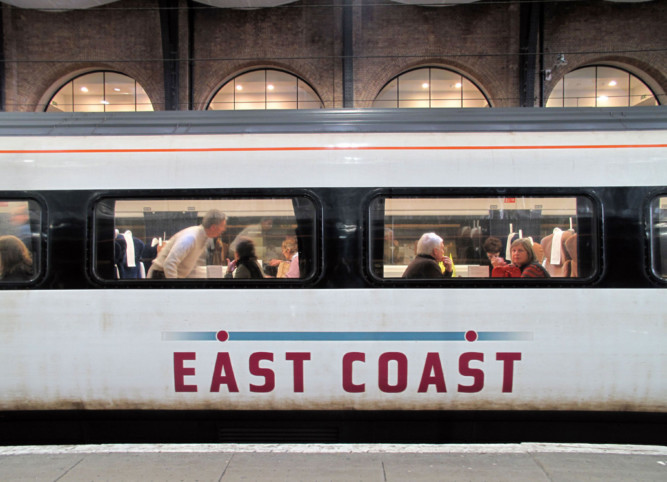 An East Coast train waits at a platform