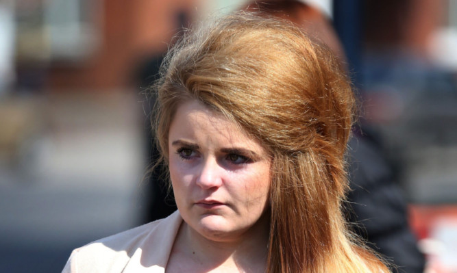 Paris Brown heads for media interviews outside Maidstone Police Station, Kent, following reports of comments she made on Twitter.