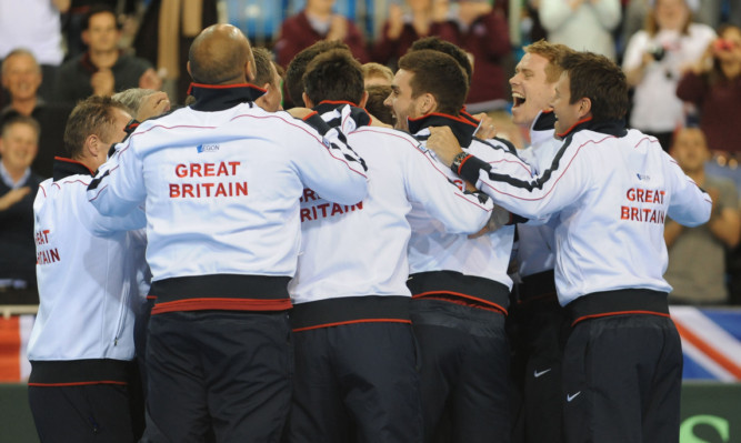 The Great Britain team celebrate victory over Russia.