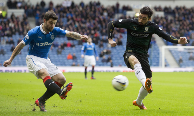 Rangers' Richard Foster (left) and Raith Rovers Rory Mckeown battle for the ball during the William Hill Scottish Cup Fifth Round match at Ibrox Stadium, Glasgow. PRESS ASSOCIATION Photo. Picture date: Sunday February 8, 2015. See PA story SOCCER Rangers. Photo credit should read: Jeff Holmes/PA Wire. EDITORIAL USE ONLY