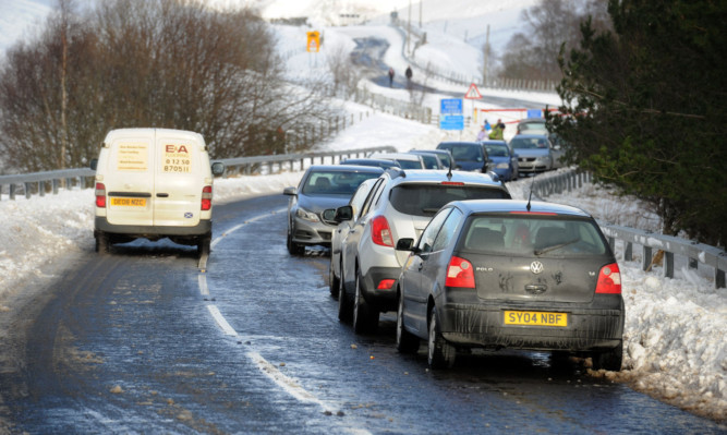 Cars parked up as winter sports enthusiasts make do with the slopes at Spittal of Glenshee earlier this month when the Glenshee snow gates were closed.