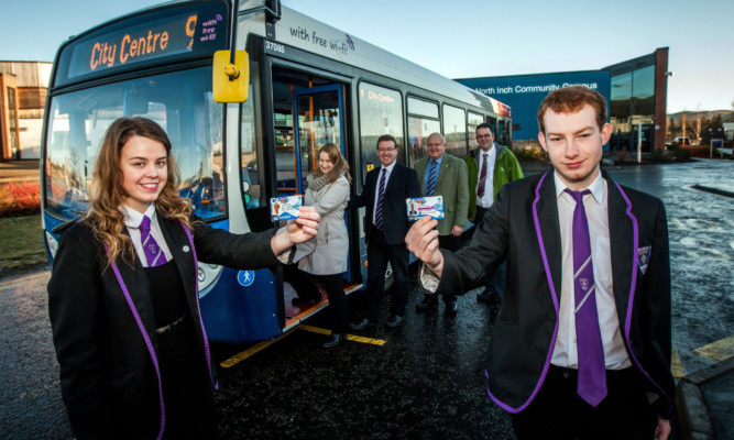 St Johns RC Academy prefects Lorraine MacKenzie and Ewan Morrison with their smartcards and, back, from left: Emma Gilbert, project manager, Transport Scotland; Andrew Jarvis, managing director, Stagecoach East Scotland; Councillor Bob Band and Paul Dailey, Perth and Kinross Council public transport unit. Picture: Steve MacDougall.