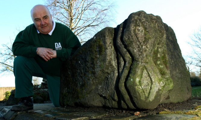 Willie Barber, head gardener at Dundee & Angus Colleges Kingsway campus, with a piece believed to be from the arch.
