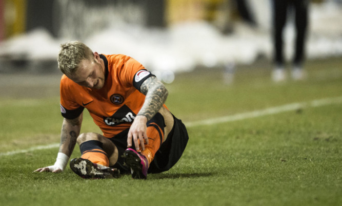 27/02/13 CLYDESDALE BANK PREMIER LEAGUE
ICT V DUNDEE UTD
TULLOCH CALEDONIAN STADIUM - INVERNESS
Dundee Utd's Johnny Russell looks to be in some pain after sustaining an injury during the first half