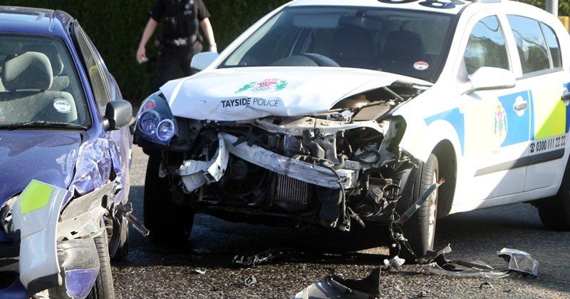 The junction of City Road / Tullideph Road, Dundee.    A  police car and Toyata Corrola collide.