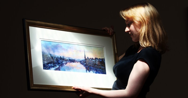 Steve MacDougall, Courier, Frames Gallery, Victoria Street, Perth. New exhibition by Liz Yule at Frames Gallery. Pictured, Art Gallery Manager Lindsey Goring with a piece by Liz Yule entitled 'Overlooking the Tay at Sunset'.