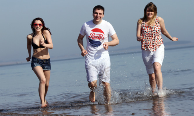 Lisa Short, Michael Grant and Megan Hubbard enjoying warm weather at Broughty Ferry this time last year. Although we're unlikely to see such conditions this weekend, we may finally be seeing the end of winter.