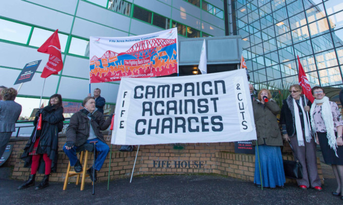 Campaigners outside Fife House in Glenrothes ahead of the budget meeting.