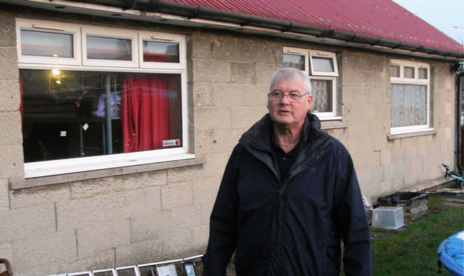 Jim Hayter outside his house at Sidlaw View Primary School.