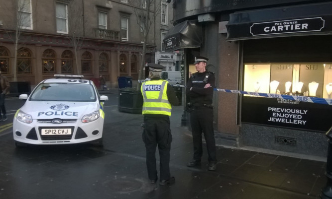 Police outside the Dundee after last week's raid.