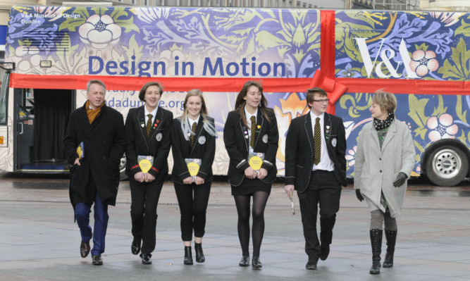Philip Long and gallery curator Alison Chisholm with pupils who visited the exhibition on its first day.