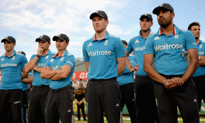 England captain Eoin Morgan and his team watch the presentations after losing against Australia on February 1.