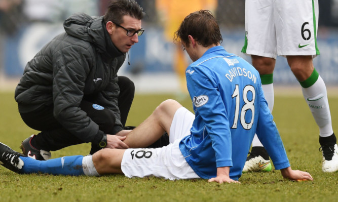 Murray Davidson receives treatment on a calf injury.