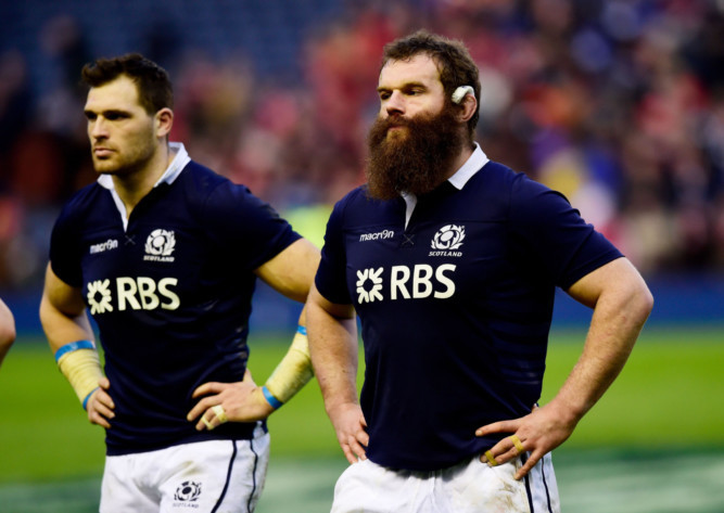 Dejected Scots Sean Lamont and Geoff Cross at the end of the game.