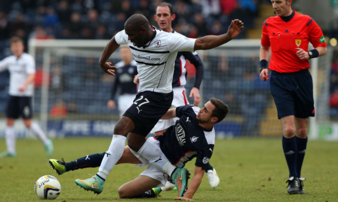 Christian Nade and Tom Taiwo compete for the ball.
