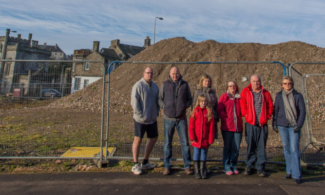 Colin Clunie, second left, along with other villagers who are objecting to the proposed plans by Campion Homes to build a three-storey complex on a derelict site in Kinghorn.