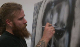 James Dorward putting the finishing touches to his now-stolen artwork.