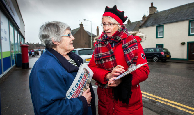 Pauline Dolby, left, gives her views to Wendy McCombe from the community consultation group in Coupar Angus.