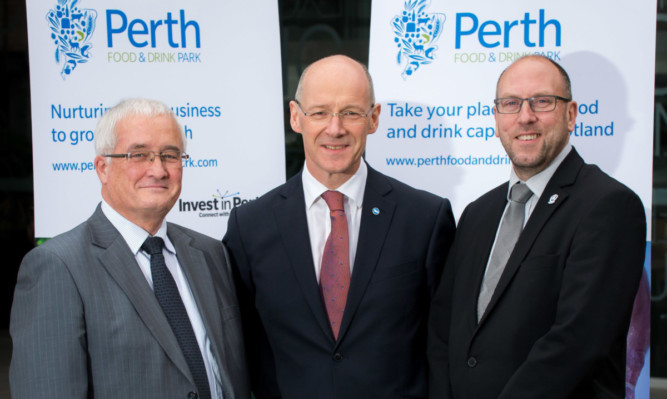 from left Perth and Kinross Councils convener of enterprise and infrastructure John Kellas, John Swinney MSP and David Littlejohn, the councils head of planning and regeneration.