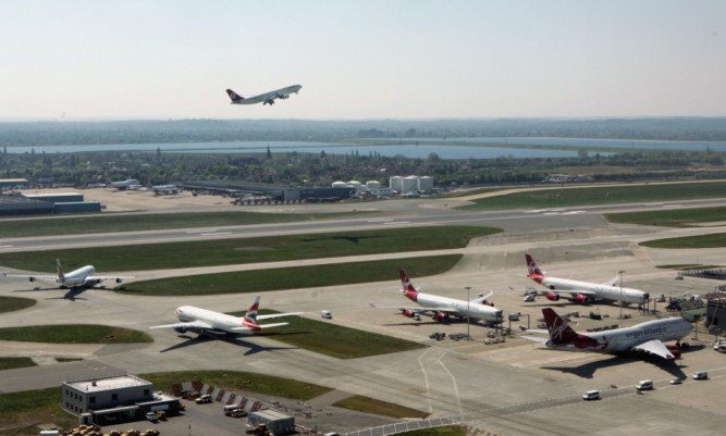 The 25-year-old woman was arrested at Heathrow.